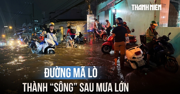 Đường Mã Lò ngập sâu sau mưa lớn, người dân chờ nước rút mới dám về nhà