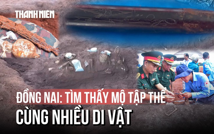 Cận cảnh chiếc bút khắc hình chim bồ câu và 2 chữ 'Tiến Quy' dưới mộ tập thể